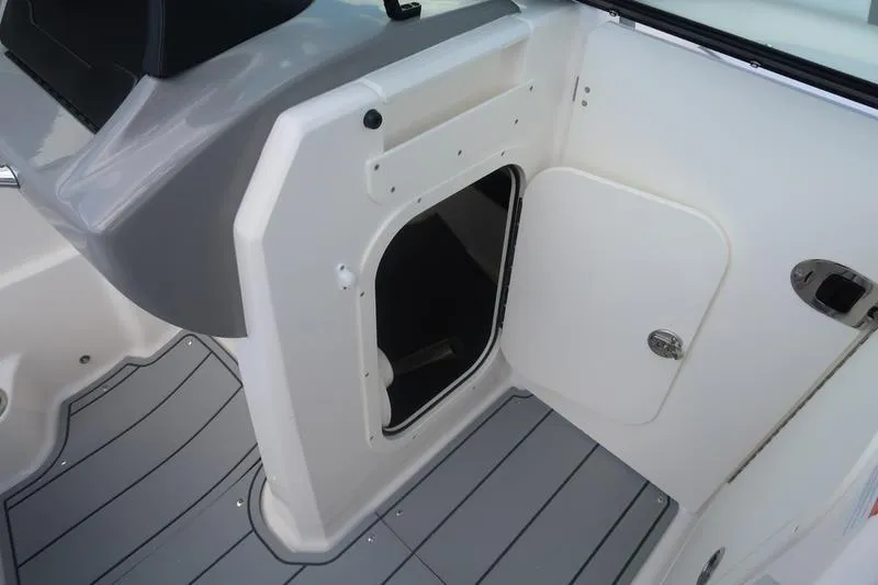 Slide: The Image of 2026 Chaparral 23 SSi boat interior with gray and white seating. - 50
