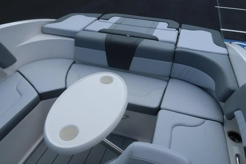 Slide: The Image of 2026 Chaparral 23 SSi boat interior with gray seating and sleek design. - 52
