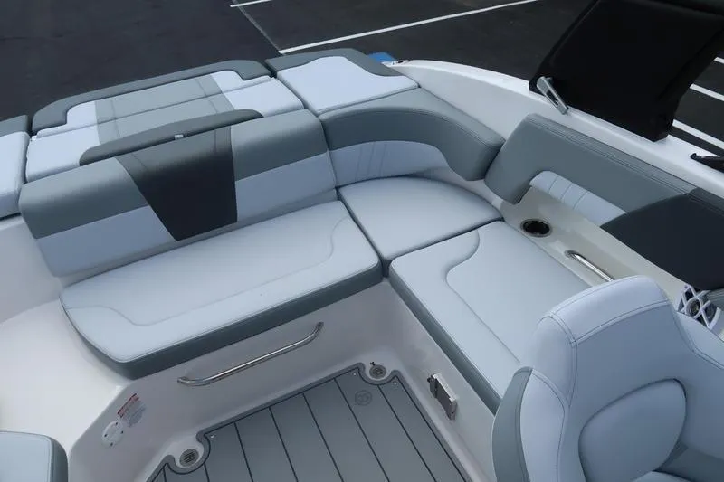 Slide: The Image of 2026 Chaparral 23 SSi boat interior with modern steering and comfortable seating. - 54