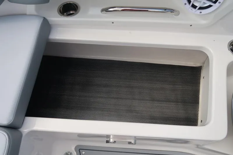 Slide: The Image of 2026 Chaparral 23 SSi boat interior with seating and oval table. - 57