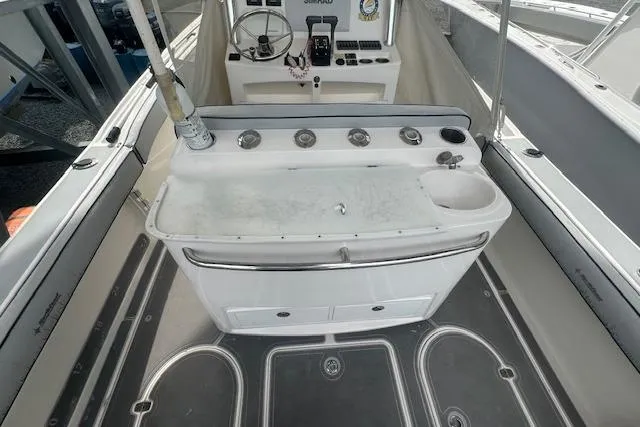 Slide: The Image of 2017 NorthCoast 260 CC boat interior with control panel and storage compartments. - 5