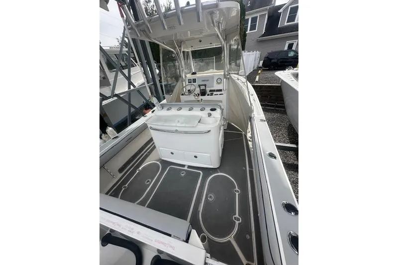 Slide: The Image of 2017 NorthCoast 260 CC boat interior with helm and seating area. - 7