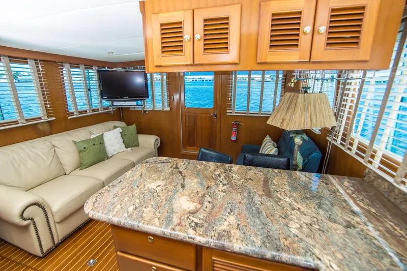 Slide: The Image of Luxurious interior of 2008 North Pacific 43 Pilothouse yacht with elegant furnishings. - 14