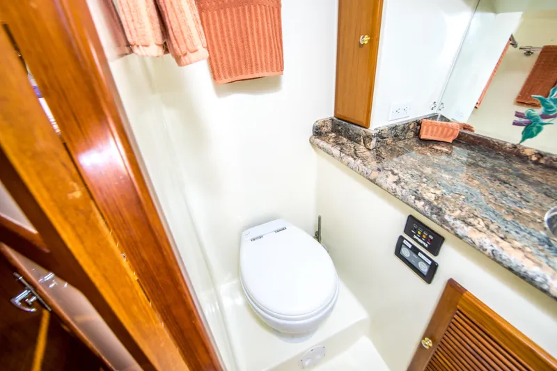 Slide: The Image of Bathroom interior of 2008 North Pacific 43 Pilothouse with granite countertop and modern fixtures. - 18