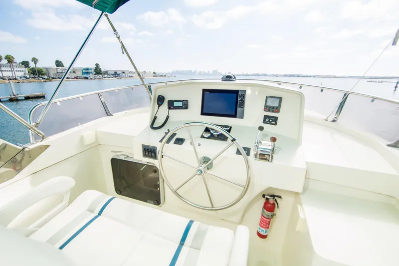 Slide: The Image of Pilothouse of 2008 North Pacific 43, featuring steering wheel and navigation equipment. - 27
