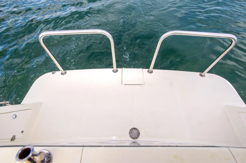 Slide: The Image of Swim platform of 2008 North Pacific 43 Pilothouse boat with stainless steel railings. - 34