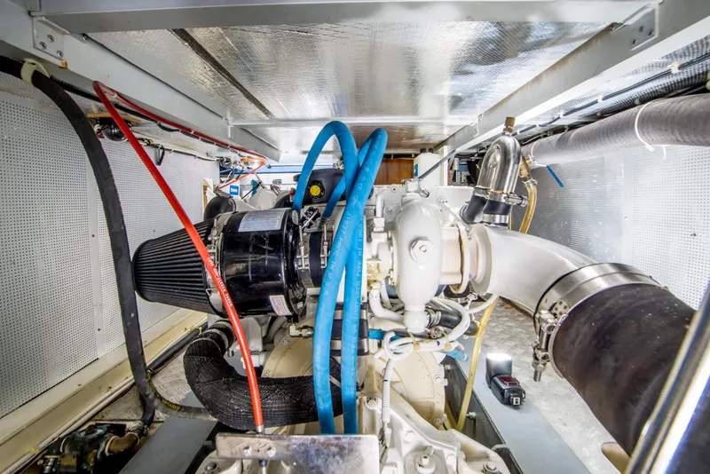Slide: The Image of Engine room of 2008 North Pacific 43 Pilothouse with visible hoses and components. - 37
