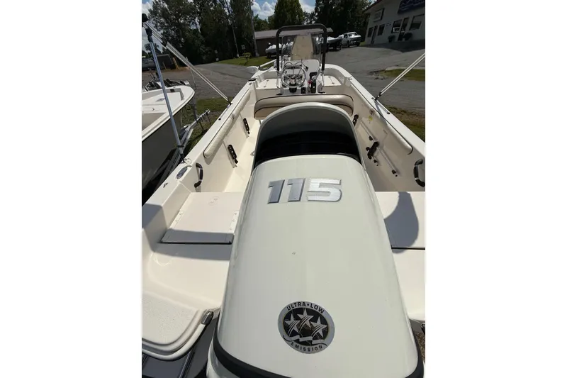 Slide: The Image of 2020 Carolina Skiff 19 LS boat with 115 horsepower engine, parked outdoors. - 14