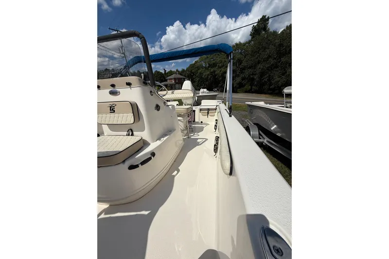 Slide: The Image of 2020 Carolina Skiff 19 LS boat with seating, under a clear blue sky. - 19