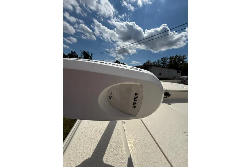 Slide: The Image of 2020 Carolina Skiff 19 LS boat with Riptide motor under a cloudy sky. - 5