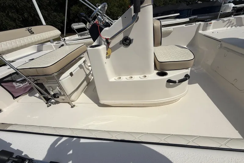 Slide: The Image of 2020 Carolina Skiff 19 LS boat interior with seating and console details. - 9
