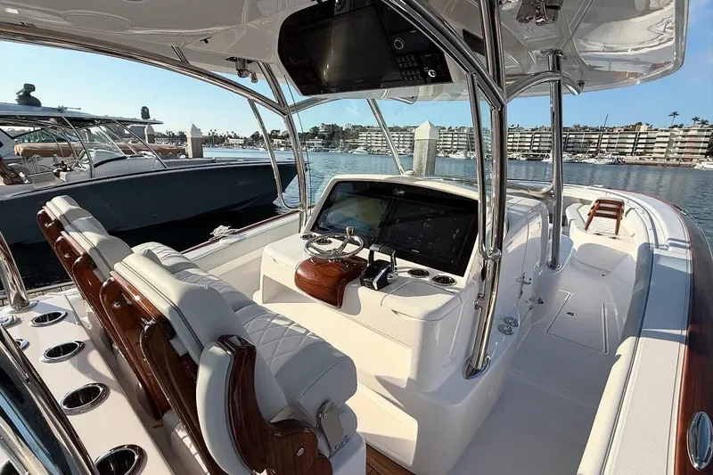 Slide: The Image of 2026 Mag Bay 38 CC boat interior with sleek console and luxurious seating. - 3