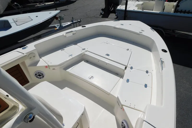 Slide: The Image of 2026 Pathfinder 2400 TRS boat interior with spacious seating and storage compartments. - 11