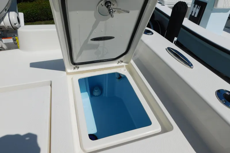 Slide: The Image of Open storage compartment on 2026 Pathfinder 2400 TRS boat deck. - 12