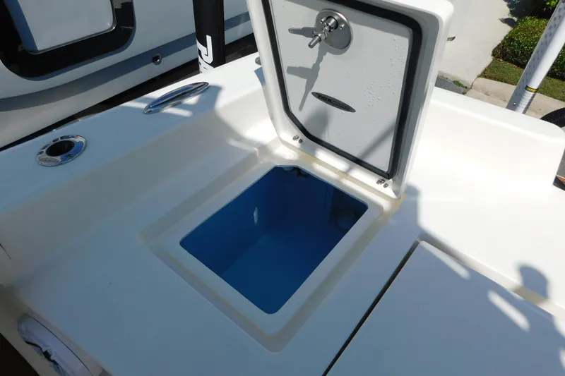 Slide: The Image of Open storage compartment on 2026 Pathfinder 2400 TRS boat deck. - 13