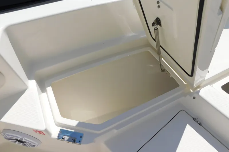 Slide: The Image of Open storage compartment on 2026 Pathfinder 2400 TRS boat, showcasing interior space. - 17