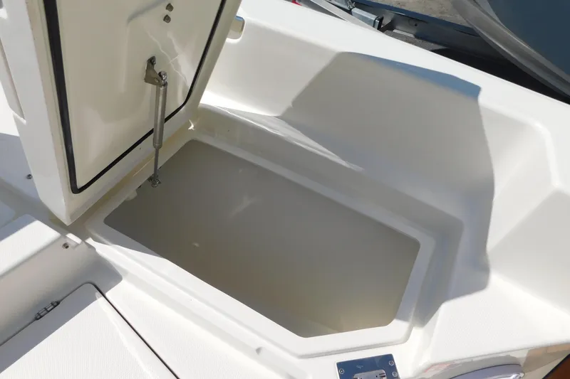 Slide: The Image of Open storage compartment on 2026 Pathfinder 2400 TRS boat. - 18