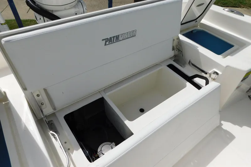 Slide: The Image of 2026 Pathfinder 2400 TRS boat storage compartments and seating area. - 22