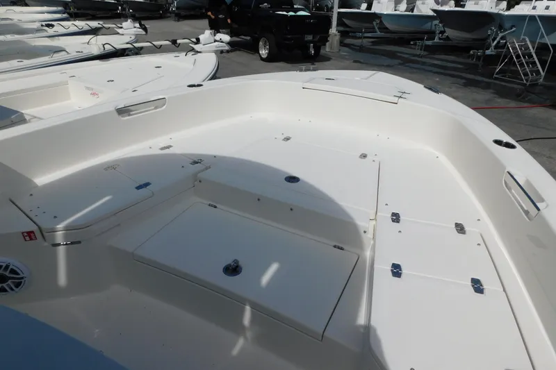 Slide: The Image of 2026 Pathfinder 2400 TRS boat interior, spacious deck with storage compartments. - 29