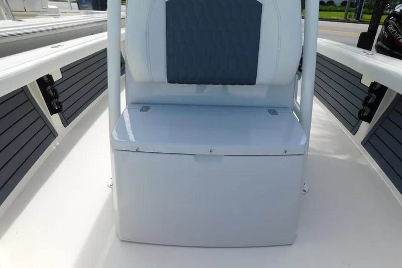 Slide: The Image of 2026 Pathfinder 2400 TRS boat interior with cushioned seating and storage compartment. - 31