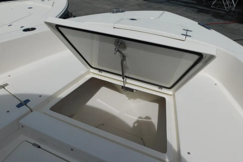 Slide: The Image of Open storage compartment on 2026 Pathfinder 2400 TRS boat deck. - 34
