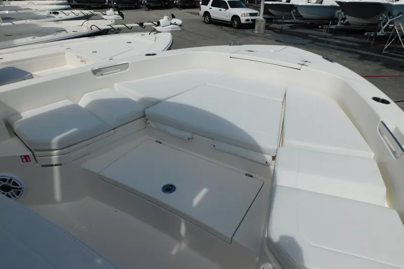 Slide: The Image of 2026 Pathfinder 2400 TRS boat with spacious white seating and storage compartments. - 40