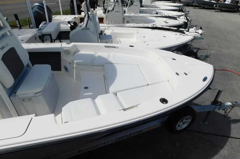 Slide: The Image of 2026 Pathfinder 2400 TRS boat on trailer, showcasing spacious deck and seating area. - 41