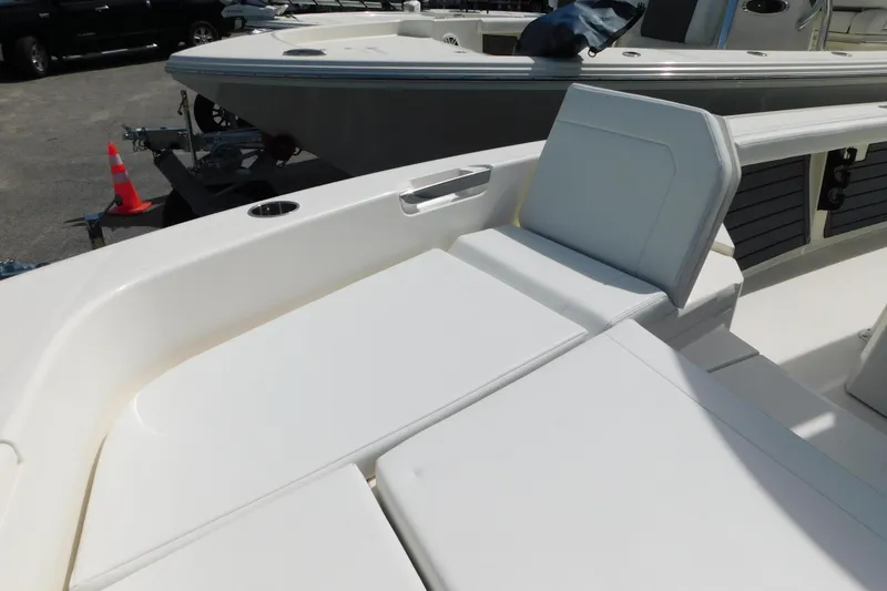 Slide: The Image of 2026 Pathfinder 2400 TRS boat interior with cushioned seating and sleek design. - 43
