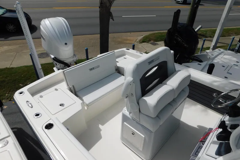 Slide: The Image of 2026 Pathfinder 2400 TRS boat interior with white seating and modern controls. - 5