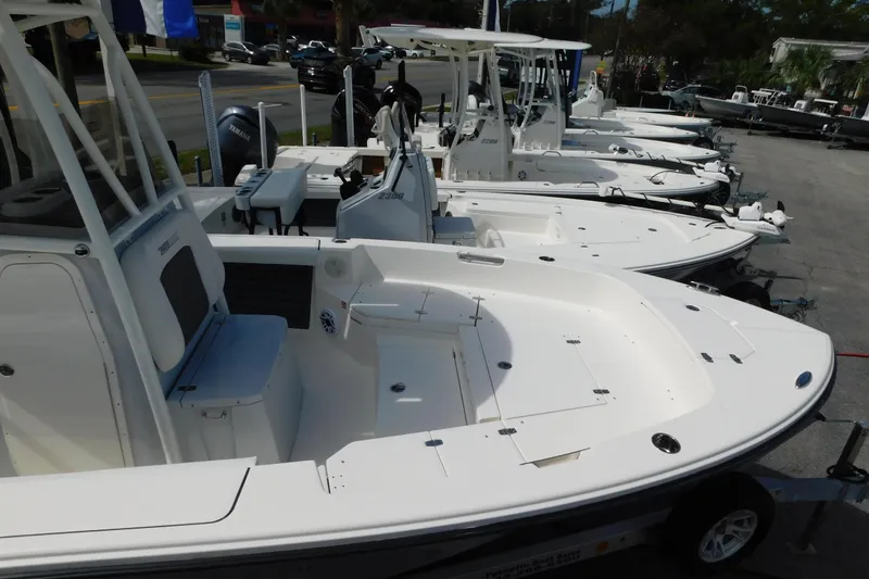 Slide: The Image of Line of 2026 Pathfinder 2400 TRS boats displayed at a dealership. - 6