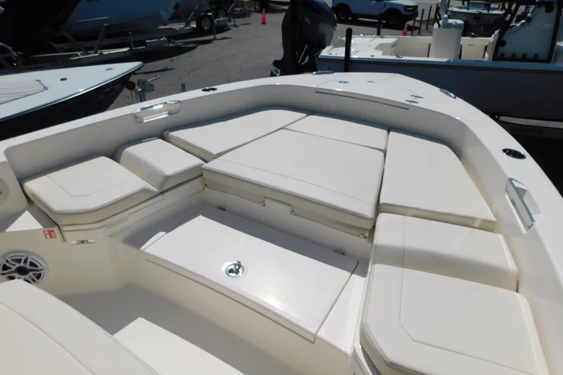Slide: The Image of 2026 Pathfinder 2400 TRS boat with spacious cushioned seating area. - 8