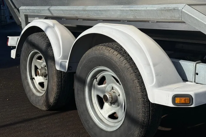 Slide: The Image of Trailer wheels and fenders of a 2006 Custom Weld Cobra OB boat. - 5