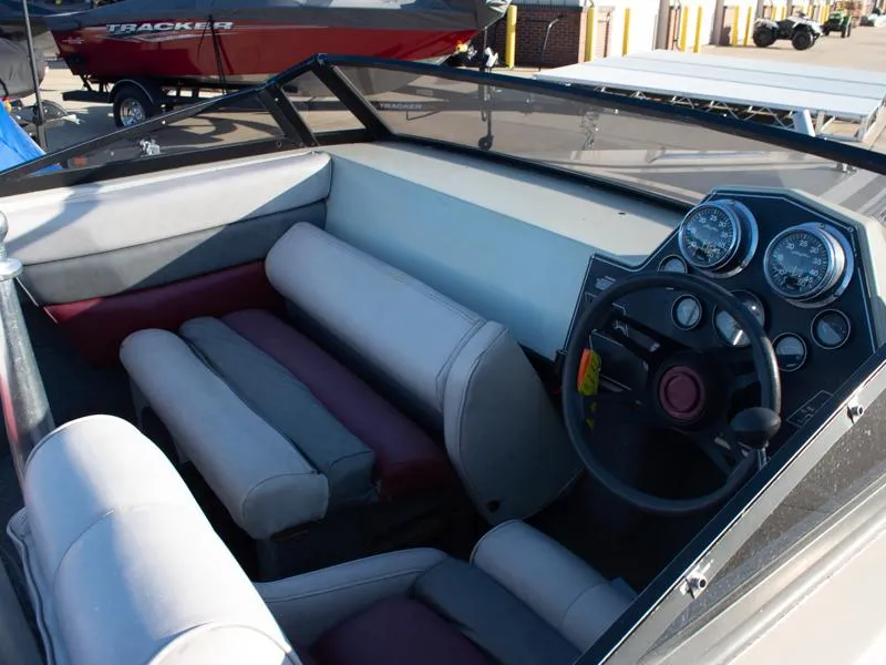 Slide: The Image of 1987 Baja 190 Sport boat interior with steering wheel and dashboard gauges. - 1