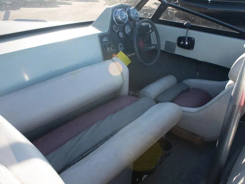 Slide: The Image of 1987 Baja 190 Sport boat interior with steering wheel and dashboard gauges. - 10