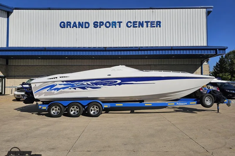 Slide: The Image of 2004 Baja 29 Outlaw boat on trailer at Grand Sport Center. - 1