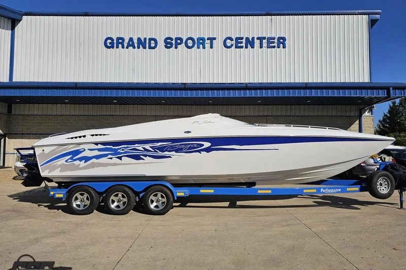 Slide: The Image of 2004 Baja 29 Outlaw boat on trailer at Grand Sport Center. - 2