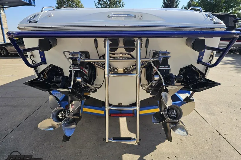 Slide: The Image of 2004 Baja 29 Outlaw boat rear view with dual propellers and ladder. - 29