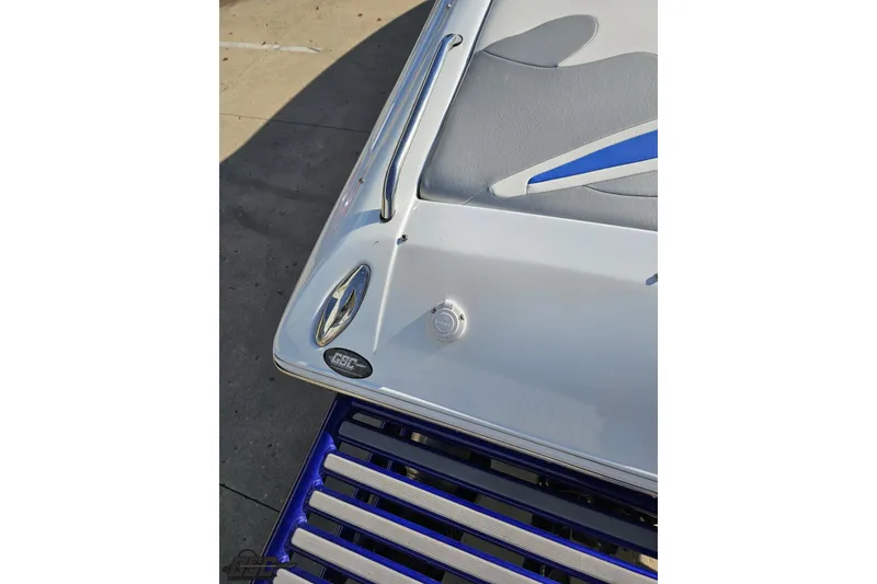 Slide: The Image of 2004 Baja 29 Outlaw boat detail with sleek design and blue accents. - 33