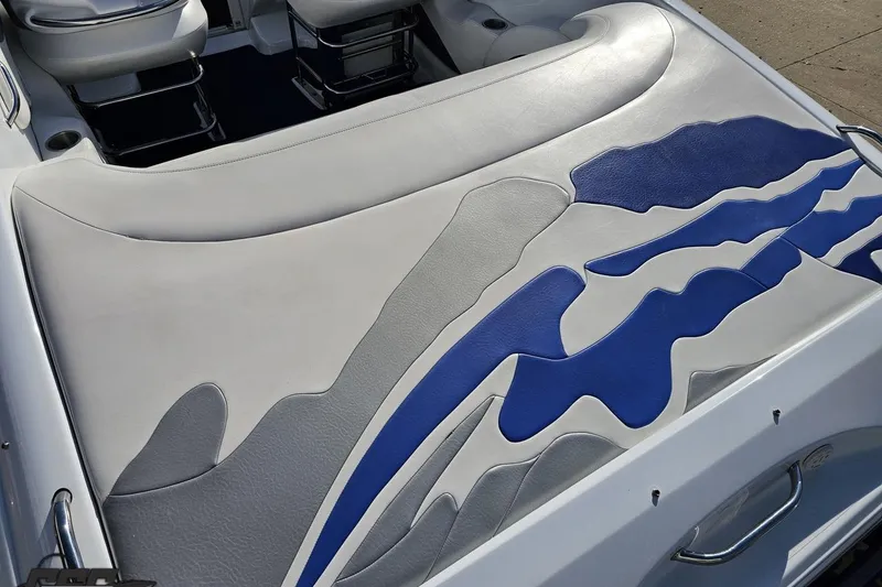 Slide: The Image of 2004 Baja 29 Outlaw boat interior with stylish blue and gray upholstery design. - 35