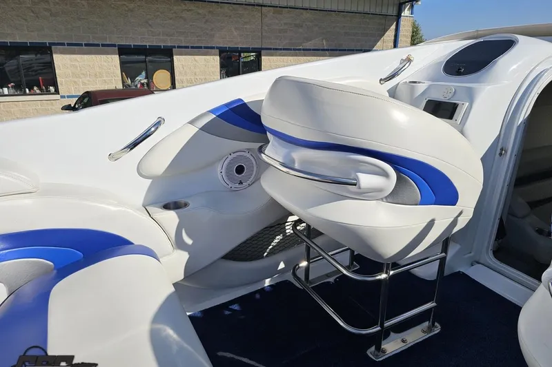 Slide: The Image of 2004 Baja 29 Outlaw boat interior with white and blue seating. - 50