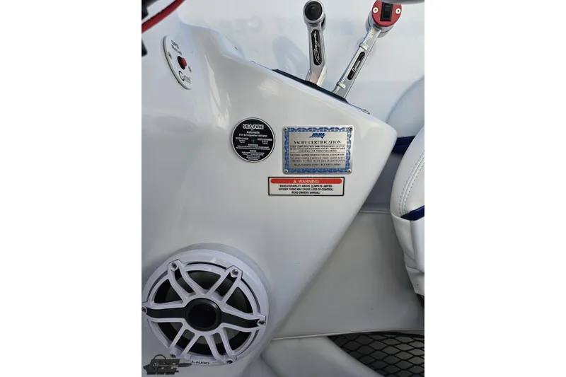 Slide: The Image of 2004 Baja 29 Outlaw interior with control levers and speaker detail. - 56