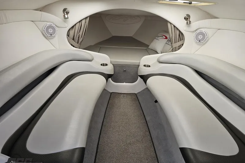 Slide: The Image of 2004 Baja 29 Outlaw boat interior with sleek white seating and modern design. - 58