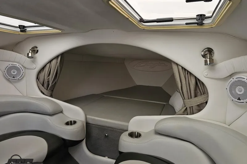 Slide: The Image of Interior of a 2004 Baja 29 Outlaw boat with seating and speakers. - 61