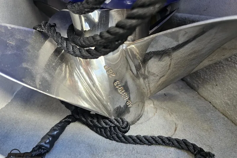 Slide: The Image of Close-up of a 2004 Baja 29 Outlaw boat propeller with black rope. - 67