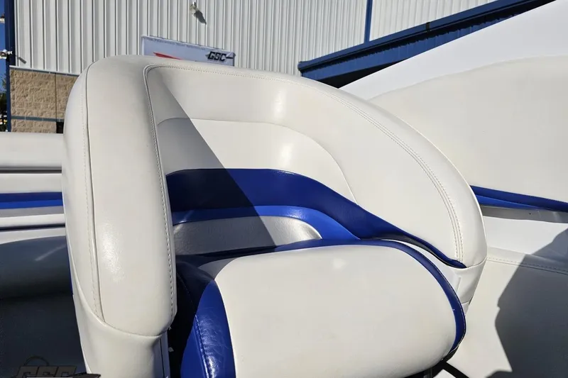 Slide: The Image of 2004 Baja 29 Outlaw boat seat with white and blue upholstery. - 71