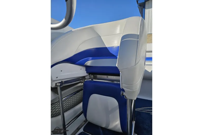 Slide: The Image of 2004 Baja 29 Outlaw boat seat with blue and white upholstery. - 72