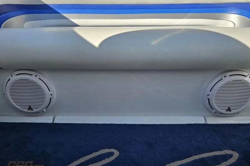 Slide: The Image of 2004 Baja 29 Outlaw boat interior with dual speakers and blue accents. - 73