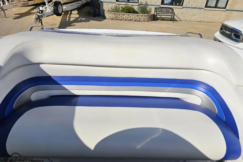 Slide: The Image of 2004 Baja 29 Outlaw boat interior with white and blue seating. - 74