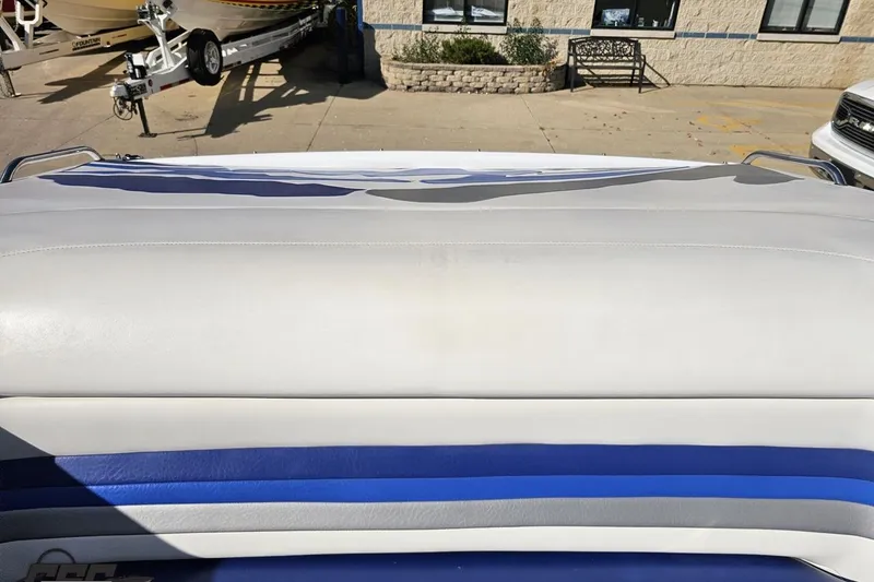 Slide: The Image of 2004 Baja 29 Outlaw boat interior with white and blue upholstery. - 75