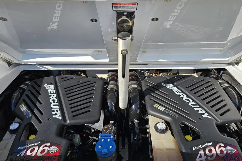 Slide: The Image of 2004 Baja 29 Outlaw boat engine compartment with dual Mercury 496 MAG engines. - 81
